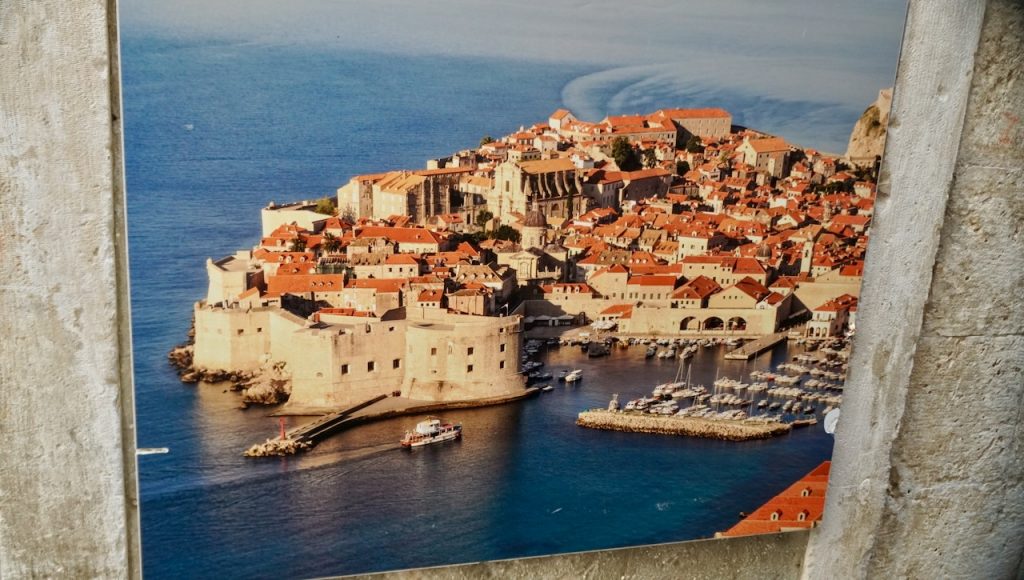 Promotional poster showing an aerial view of Dubrovnik’s walled city